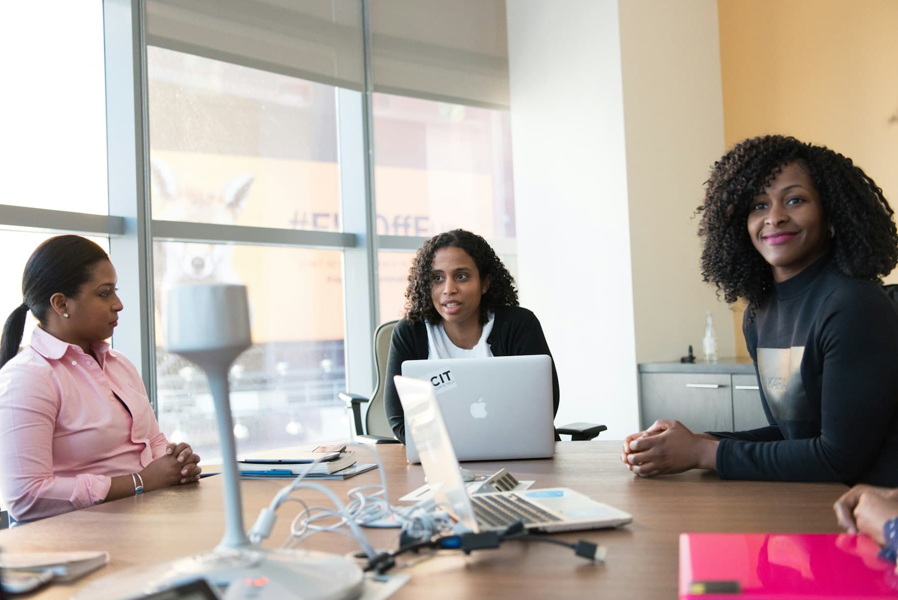 Colleagues smiling in a meeting